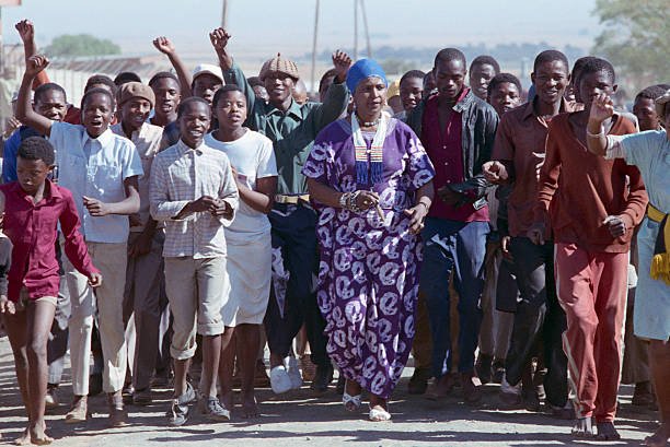 political-activist-winnie-mandela-marches-with-a-crowd-of-youths-in-picture-id635937447.jpg