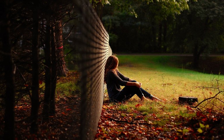 Girl-Sitting-in-Nature-Grass-Wallpaper.jpg