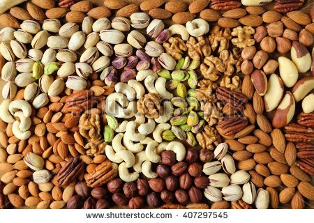 stock-photo-natural-background-made-from-different-kinds-of-nuts-407297545.jpg