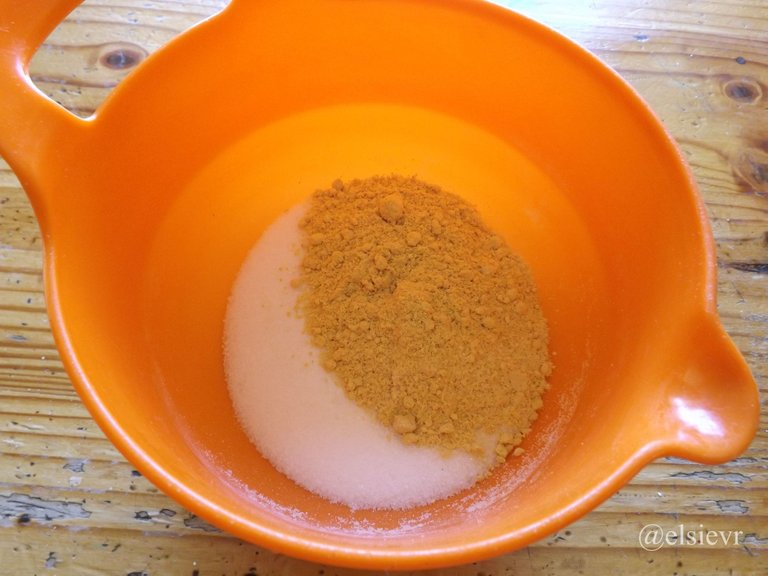 orange plastic bowl with mustard powder and sugar.jpg