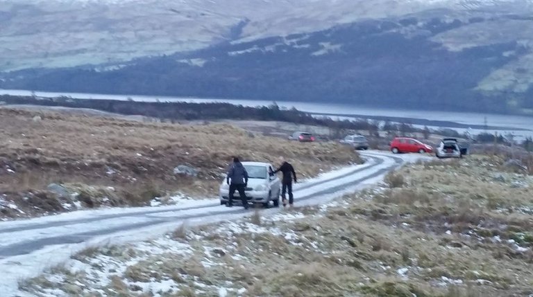 Car on icy road, Lawers car park.jpg