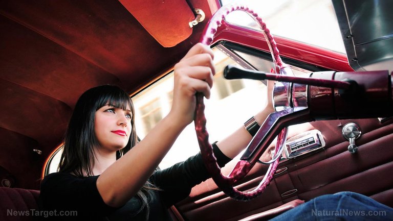 Woman-Driving-Car-Steering-Wheel.jpg