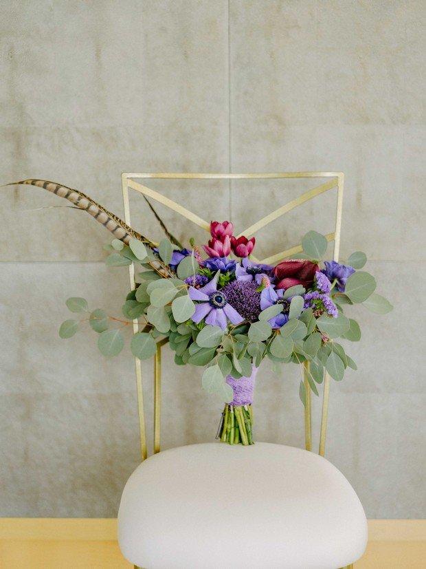 wildflower-bridal-bouquet-sitting-onelegant-chair.jpg