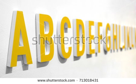 stock-photo--d-yellow-alphabet-lettering-on-a-white-wall-viewed-at-an-oblique-angle-with-a-in-the-foreground-713018431.jpg