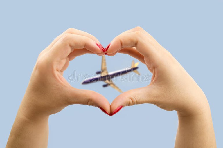 i-love-travelling-woman-making-heart-shape-her-hands-airplane-middle-65353558.jpg