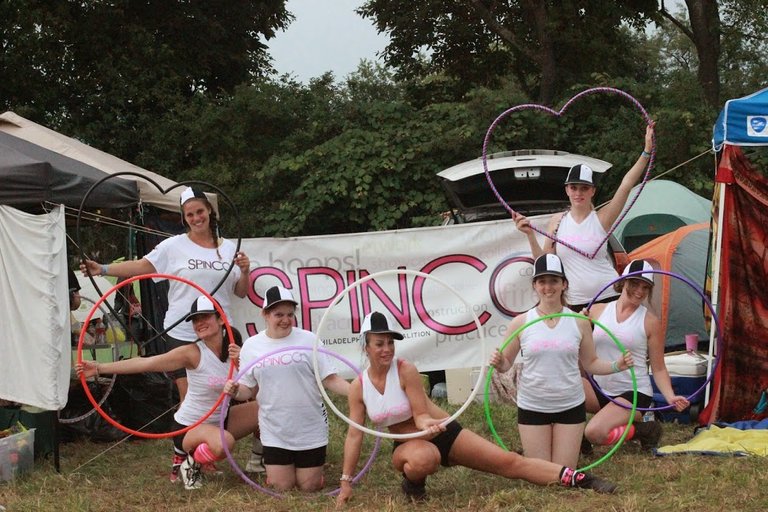 R2R dance troupe team pic in front of banner.JPG