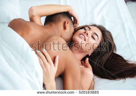 stock-photo-gentle-young-couple-lying-and-making-love-in-bed-at-home-520183885.jpg