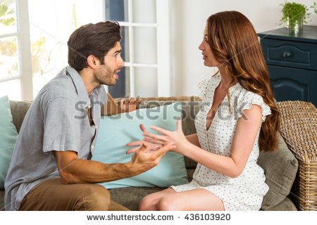 stock-photo-young-couple-into-an-argument-in-living-room-436103920.jpg