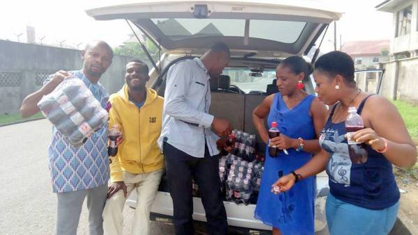 Mr.-Collins-Oscar-2nd-from-left-selling-zobo-on-the-street.jpg