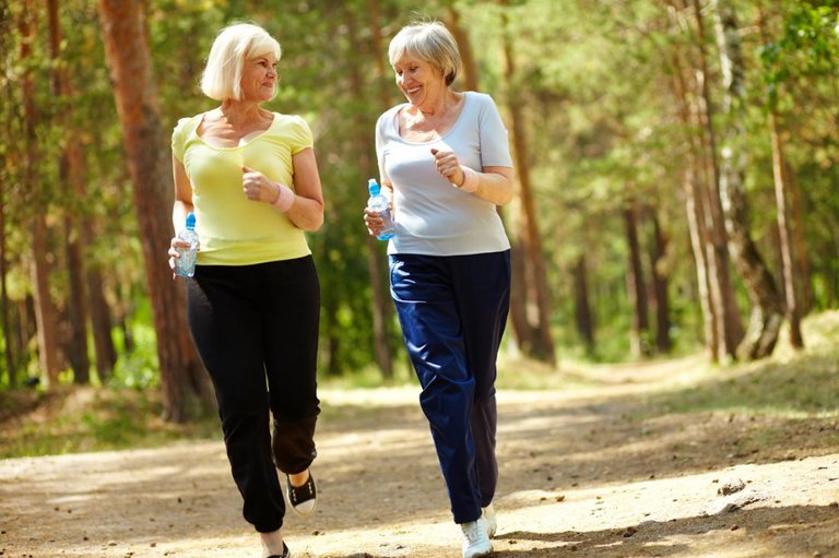 two-senior-women-running-in-the-forest.jpg