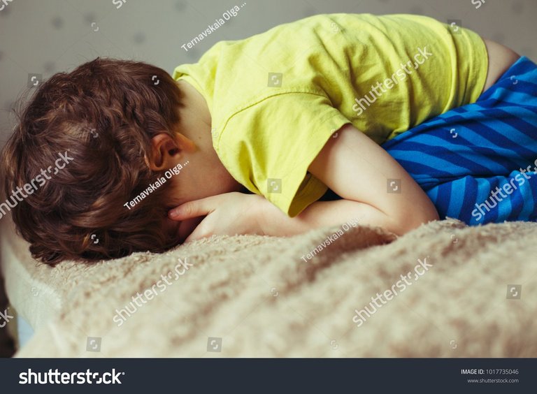 stock-photo-tired-toddler-boy-lying-on-the-bed-with-his-face-down-1017735046.jpg