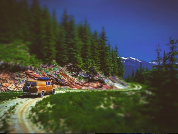 van on mountain road.png