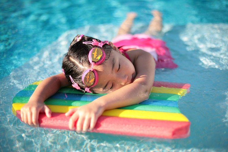 Kid-Relaxing-In-Swimming-Pool (1).jpg