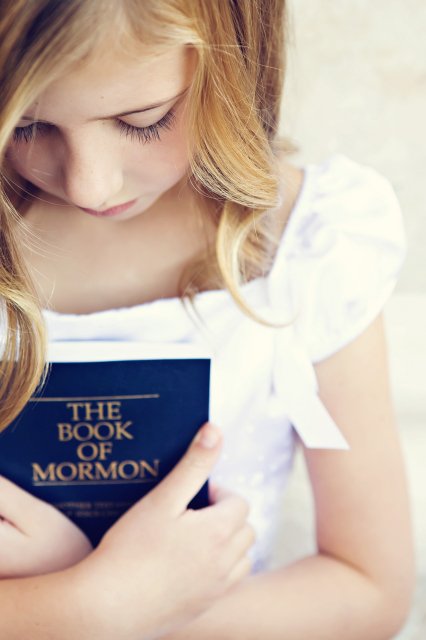 girl-holding-book-of-mormon-1062186-mobile.jpg