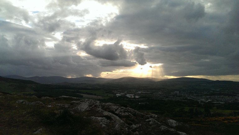  light beams in black clouds.jpg