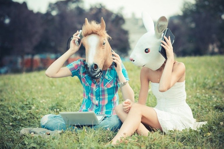 graphicstock-mask-horse-and-rabbit-women-sisters-friends-using-smartphone-and-tablet-in-the-park_BaeTDpJsk-_tn.jpg