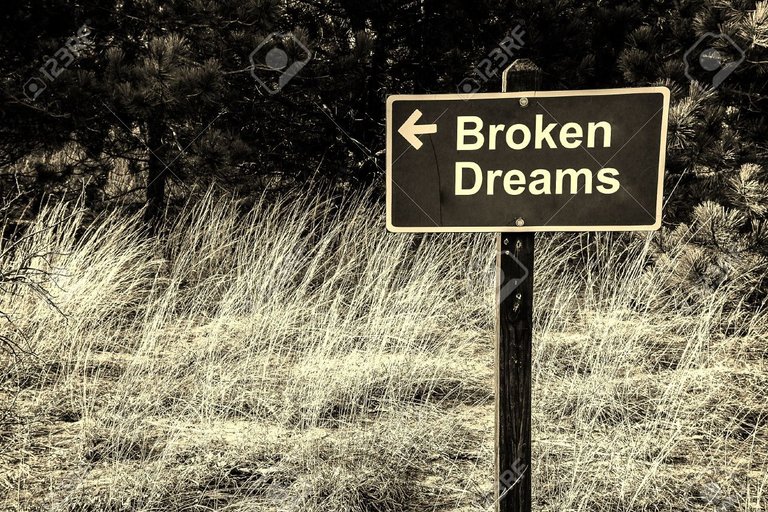 27341233-Wooden-sign-with-arrow-pointing-the-way-to-broken-dreams-Stock-Photo (1).jpg