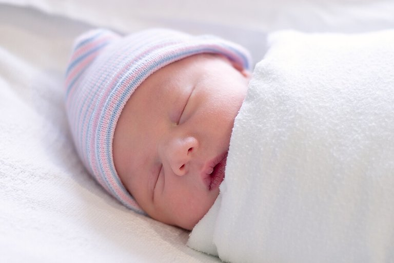 swaddled_newborn_sleeping_2.jpg