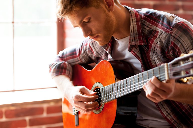 Man-playing-guitar-uberchord.jpg