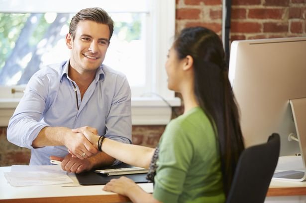 Businessman-Interviewing-Female-Job-Applicant-In-Office.jpg