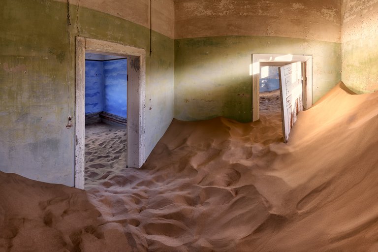 Abandoned-House-Full-of-Sand-in-the-Ghost-Town-of-Kolmanskop-Namibia.jpg