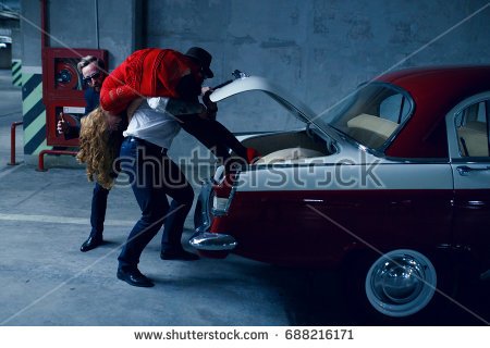 stock-photo-two-brutals-kidnapping-men-kidnap-a-young-long-haired-blonde-woman-holding-her-on-the-shoulder-and-688216171.jpg