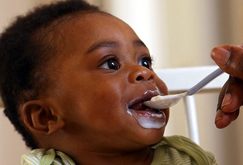 getty_rf_photo_of_baby_being_fed_with_spoon.jpg