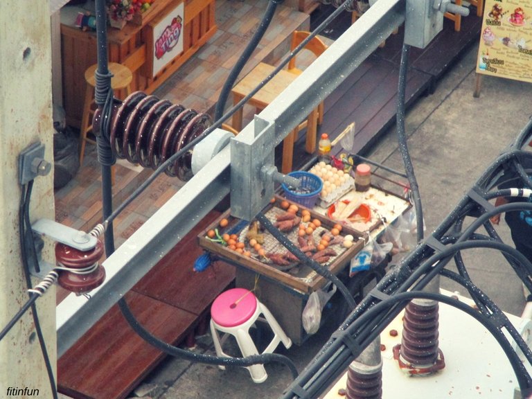 Egg lady cart through the wires cgh Bangkok Thailand fitinfun.jpg