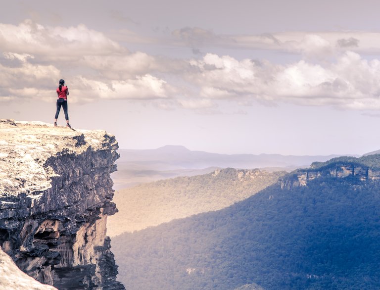 woman on edge of cliff