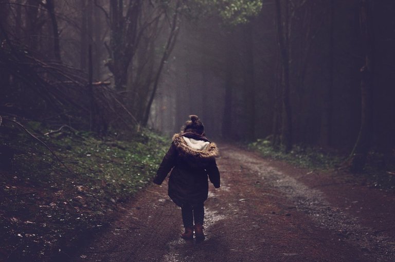 girl in pathway of wood.jpg