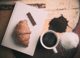 aerial-view-of-croissant-chocolate-piece-and-coffee-cup.jpg