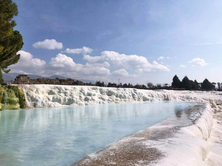 The paradisiacal spring travertine pools of Pamukkale with clean blue waters