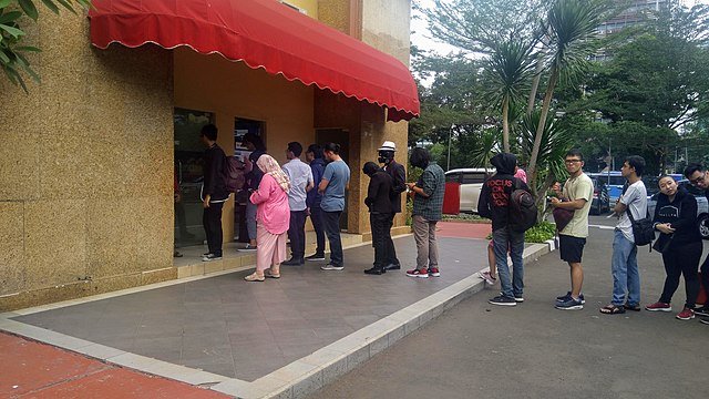 People queuing in the front of ATM in Jakarta, Indonesia