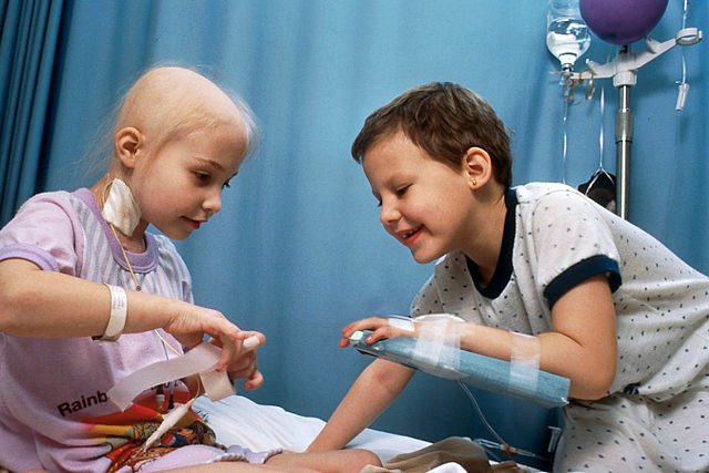 Two girls with acute lymphoblastic leukemia receiving chemotherapy.