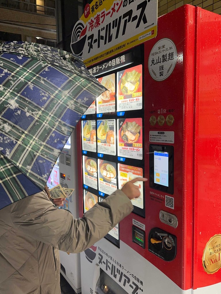 Buying ramen from a vending machine