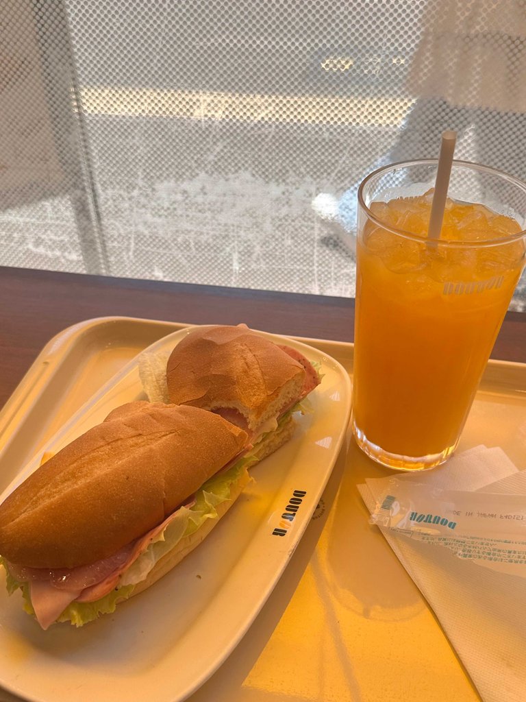 Milano-cheese sandwich and orange juice