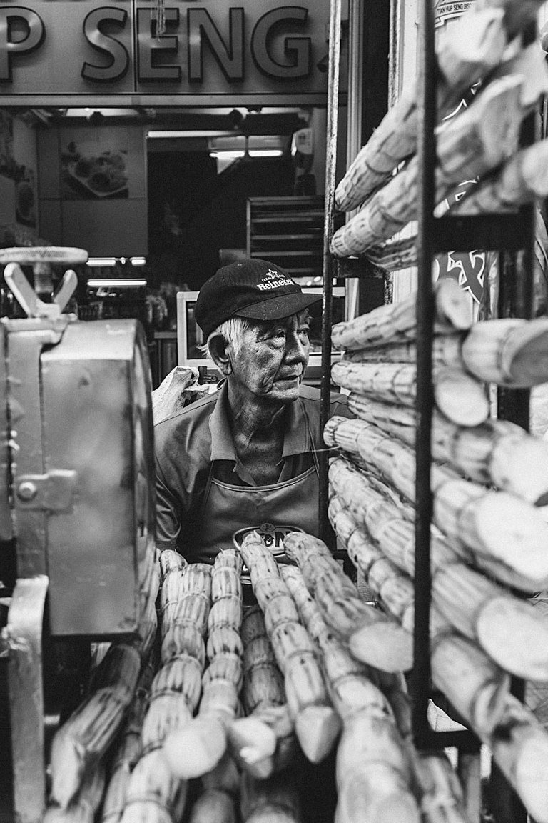 black and white portrait of sugarcane seller