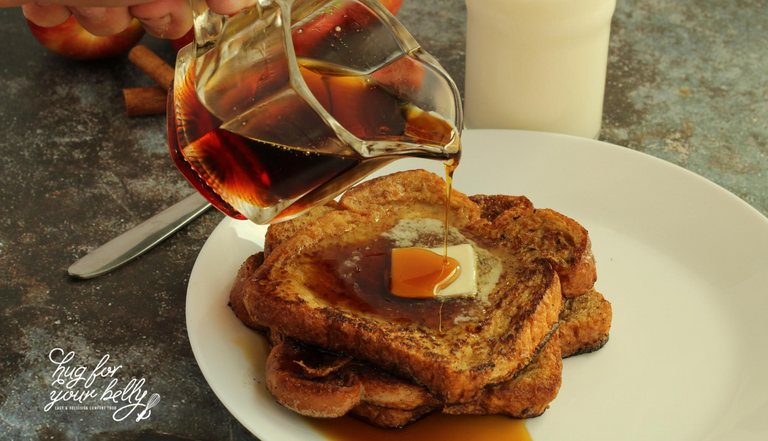 syrup being poured on apple pie french toast