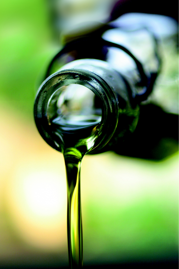 avocado oil being poured from bottle