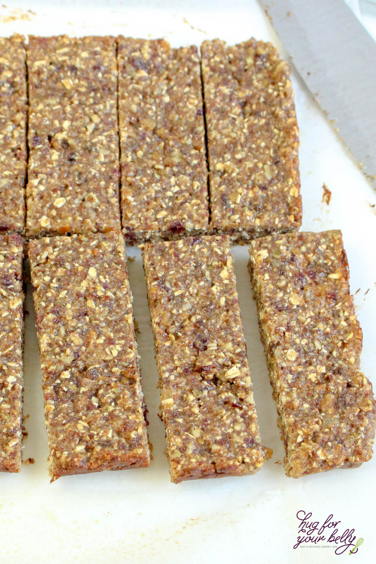 cut granola bars on white background