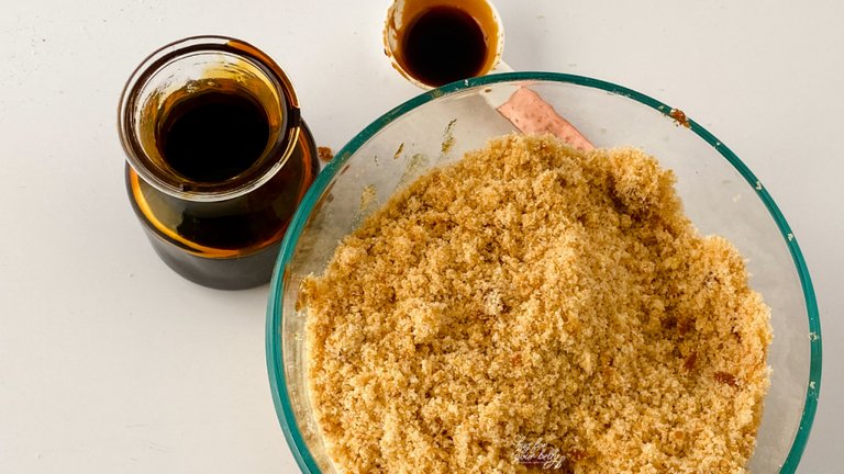 brown sugar in bowl with molasses and measuring spoon 