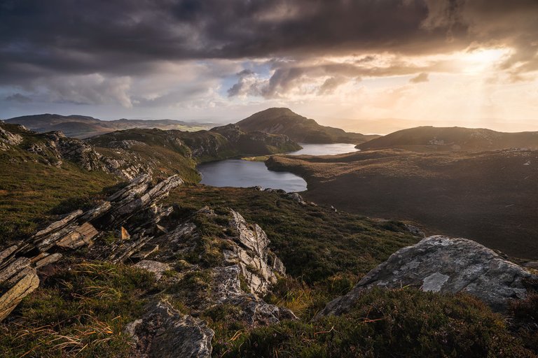 A small mountain ridge in Donegal on a stormy evening in beautiful light.