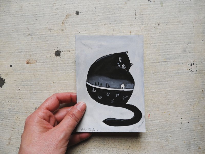 The tiny black cat. 