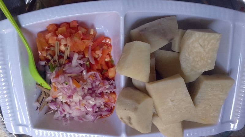 Yummy White yam with oil bean and fresh tomatoes sauce 
