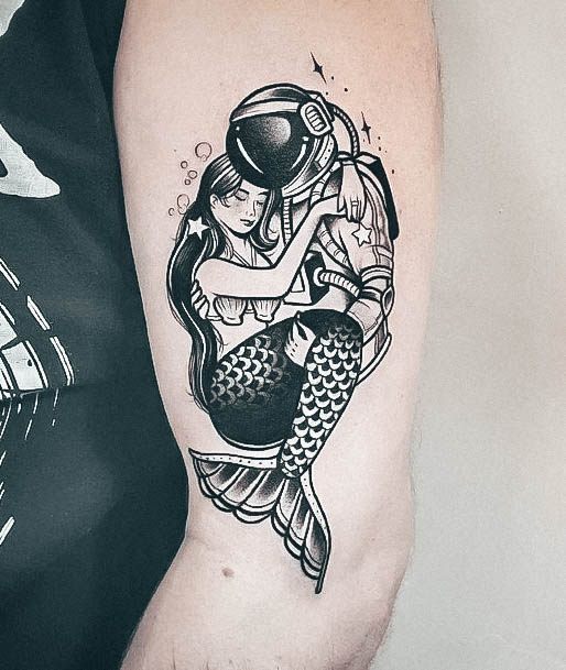 artistic-mermaid-tattoo-on-woman-outer-arm.jpg