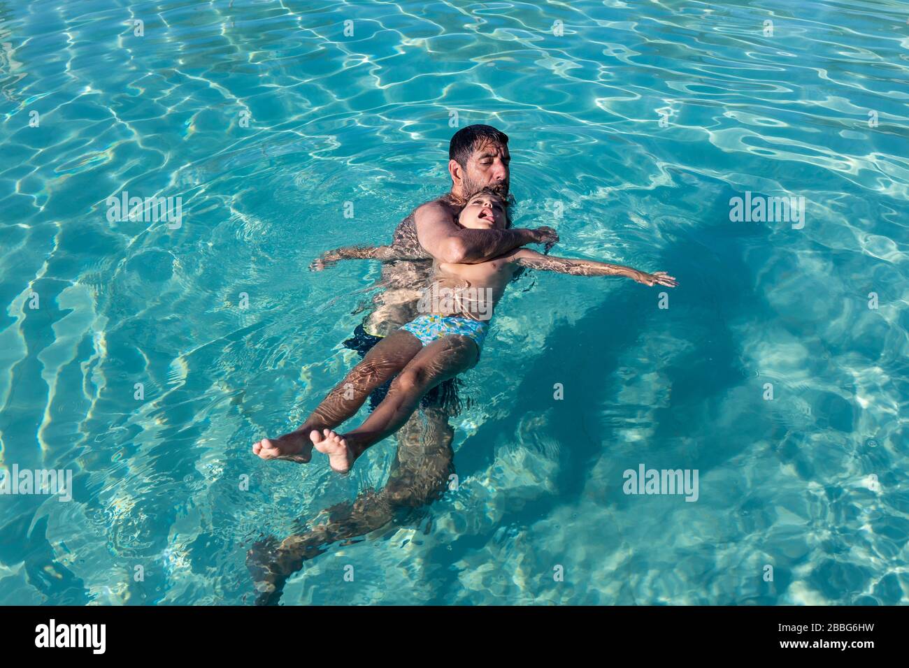 man-rescuing-boy-who-was-drowning-2BBG6HW.jpg