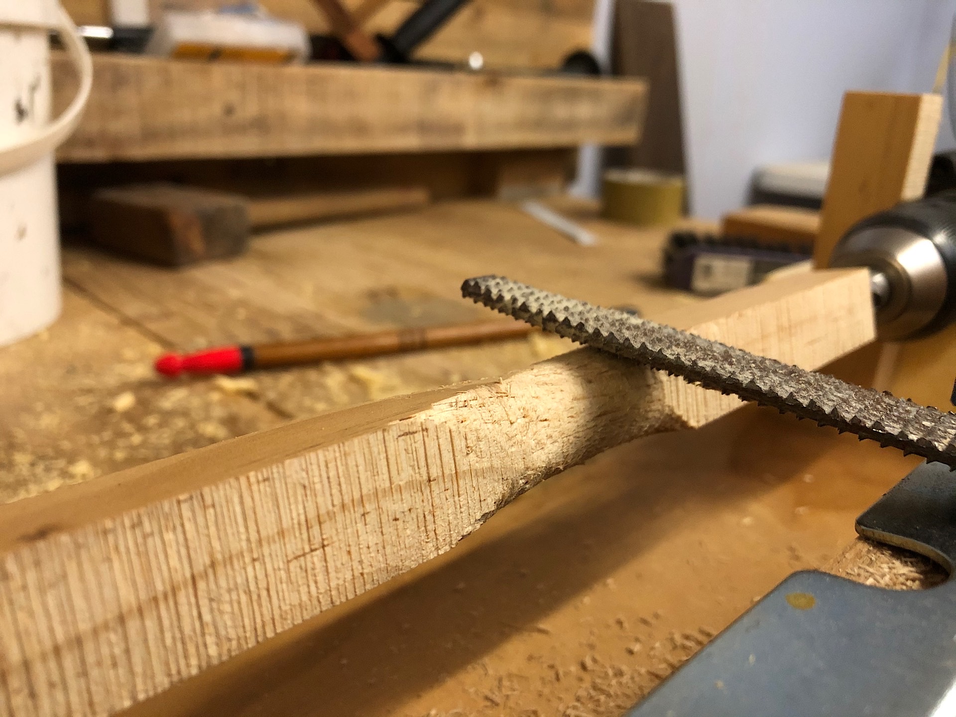 Using a rasp file to turn wood