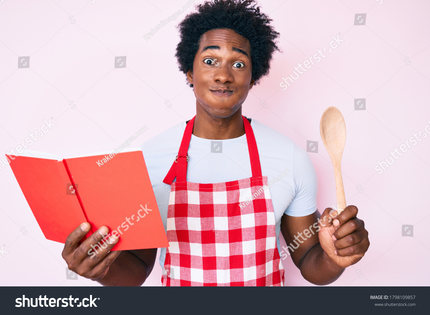 stock-photo-handsome-african-american-man-with-afro-hair-wearing-professional-baker-apron-reading-cooking-1798109857.jpg
