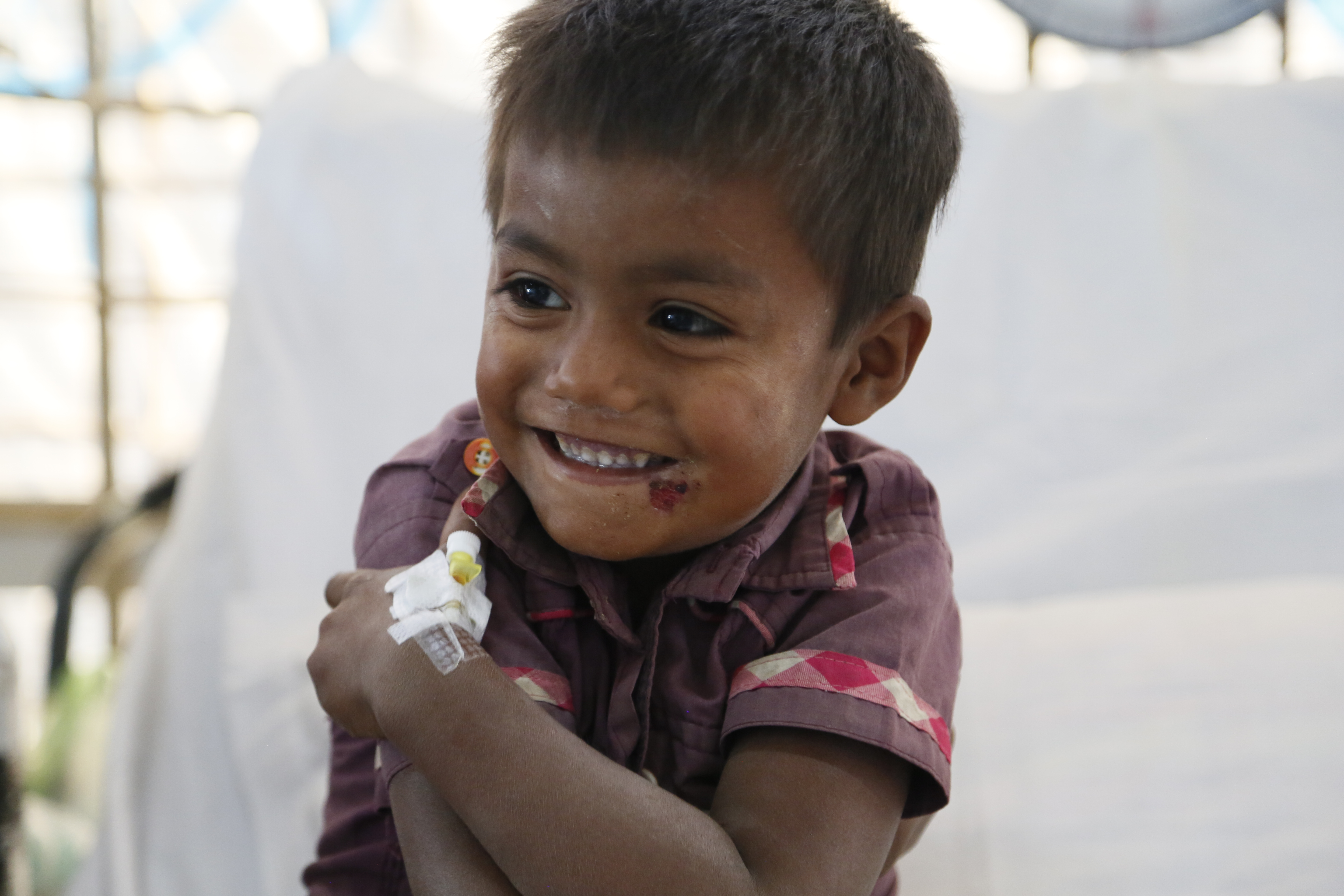 4-year-old_Rohingya_boy_Anowar,_after_being_treated_for_diphtheria_by_the_UK's_Emergency_Medical_Team_in_Kutupalong,_Bangladesh_M4A2575_(38921115865).jpg