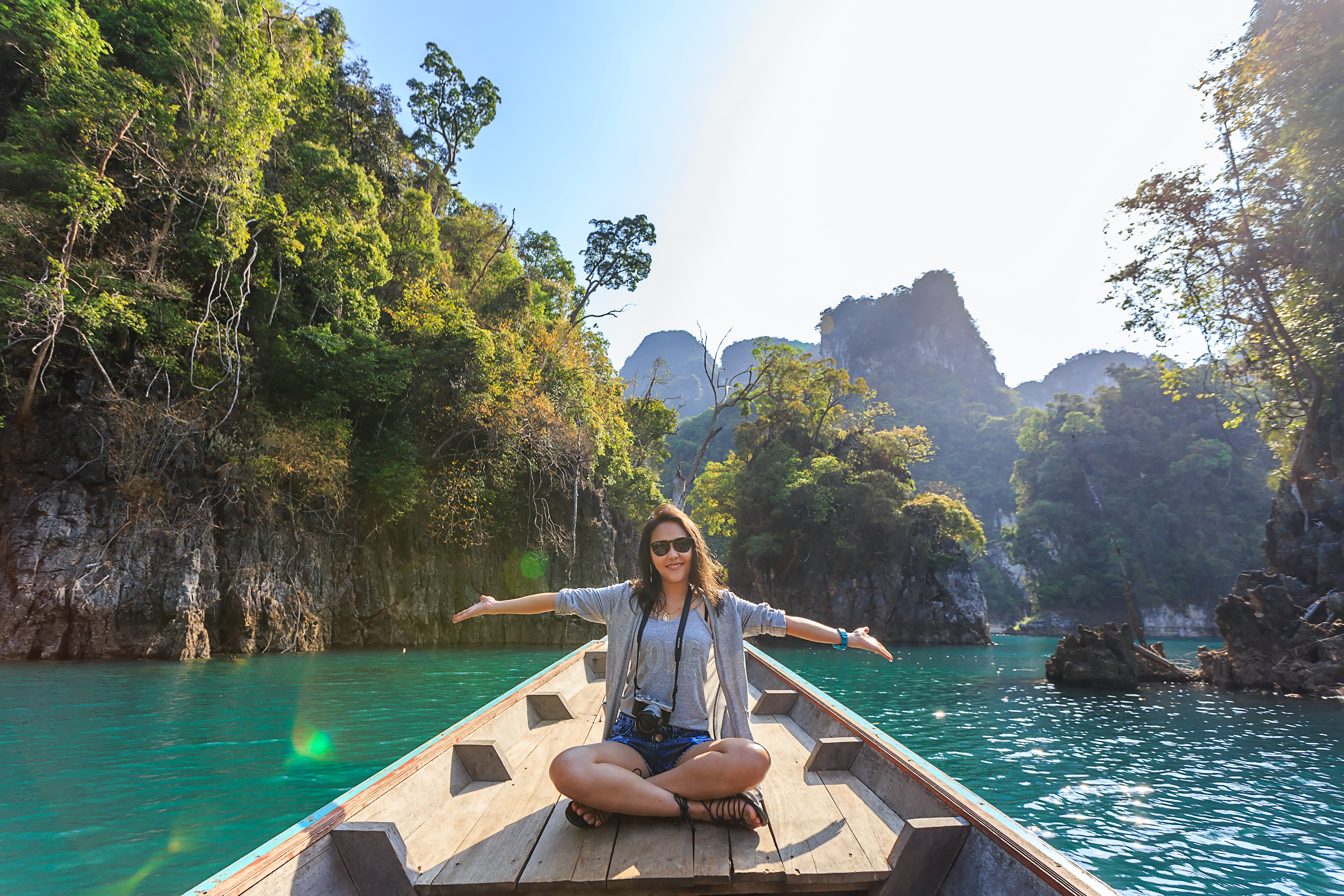 photo-of-woman-sitting-on-boat-spreading-her-arms-1371360.jpg